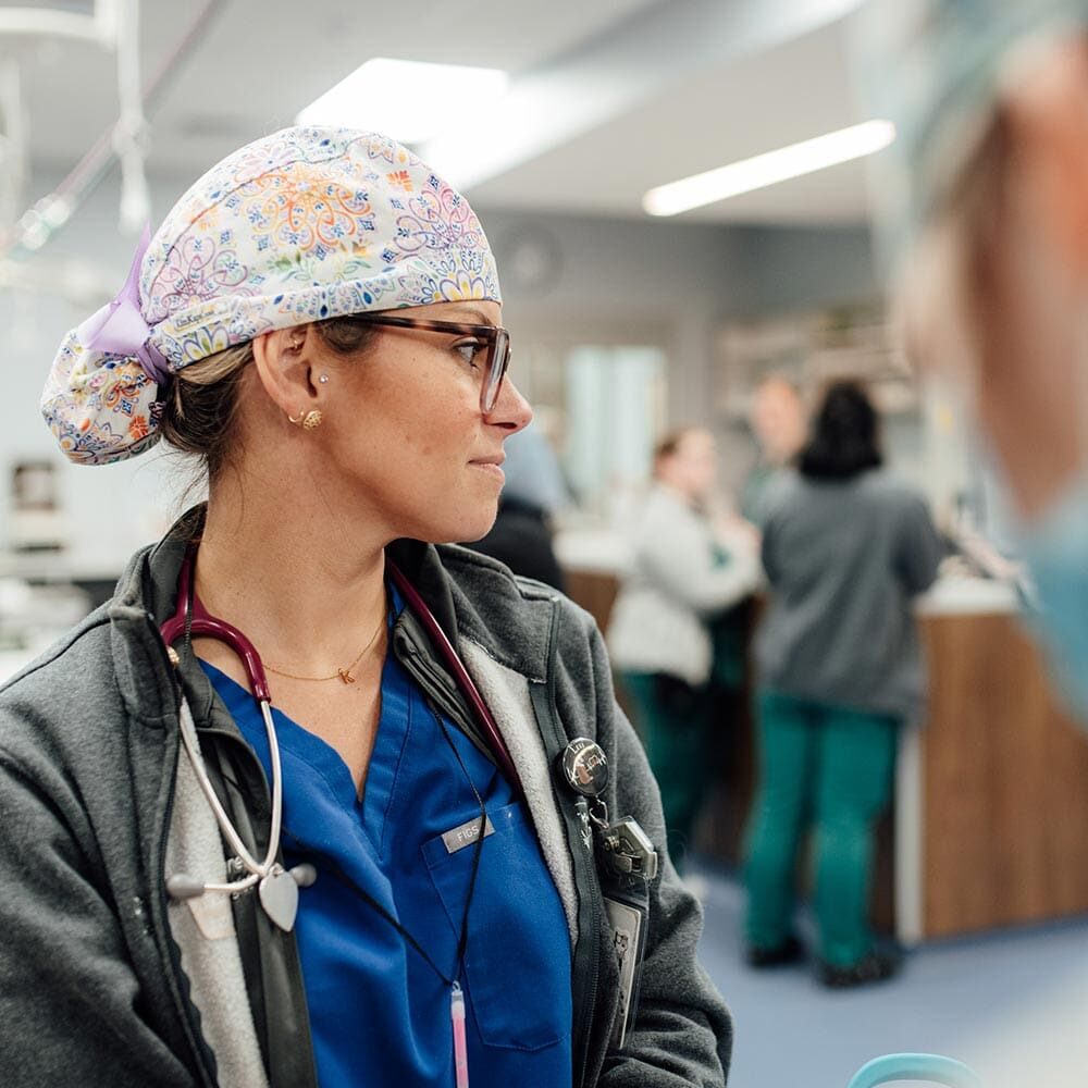 Doctor Wearing Scrub Cap Looking Off To Side Doctor Wearing Scrub Cap Looking Off To Side